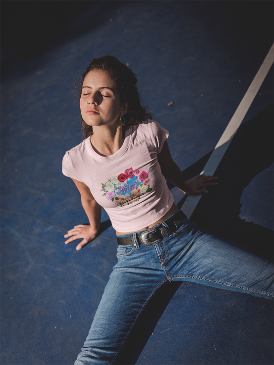 A women wearing "รักแม่ เบบี้ที (วงดอกกุหลาบ) - Love Mom Baby Tee (Roses Circle)" at front view, light pink baby tee/ crop top/ slim fit tee - Unique fashion tops for casual wear and Mother's day - Thai twist Y2k style - Front and Back printed T-shirt - Oh Mine Words