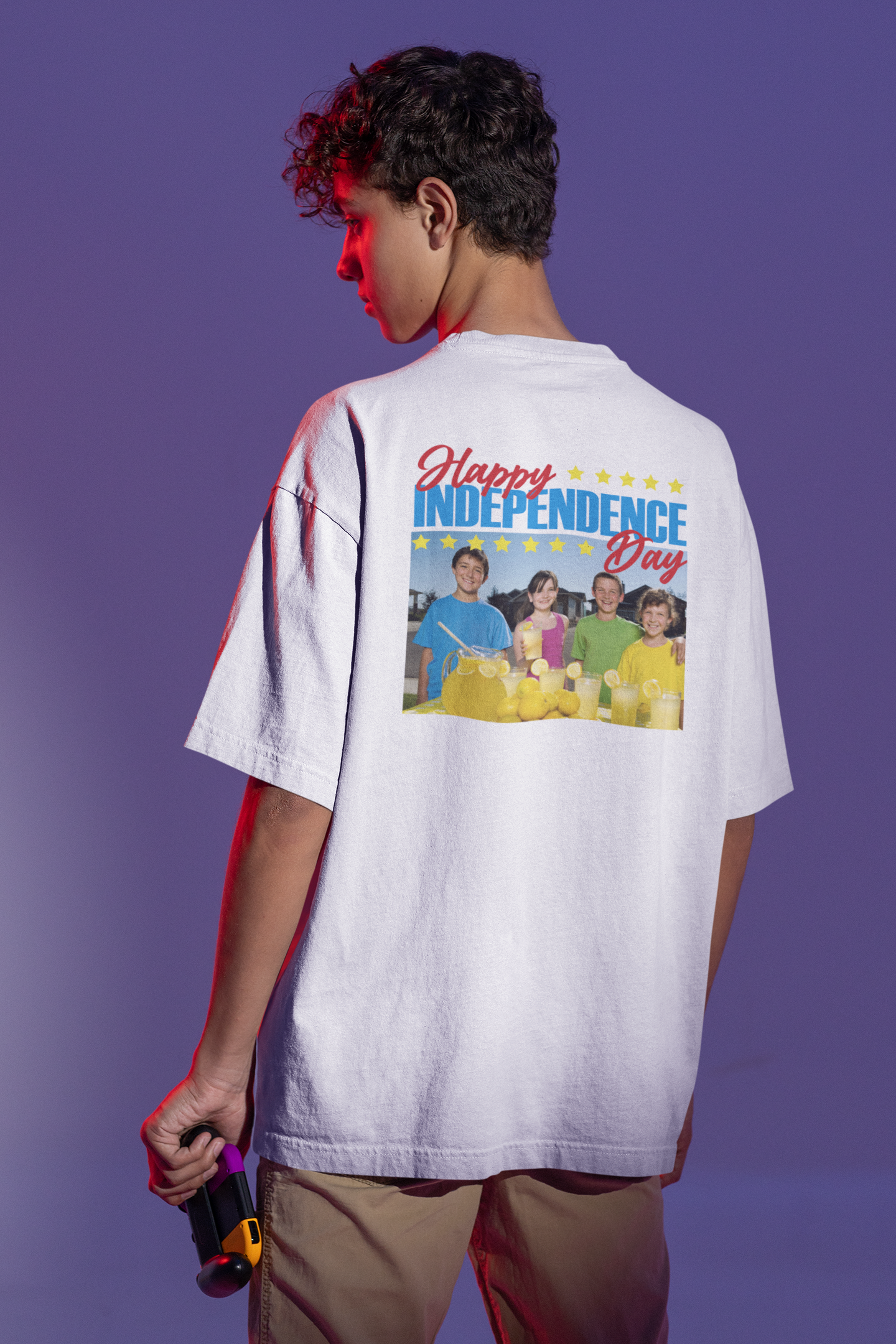 A boy wearing The Kids & Their Lemonade (Happy Independence Day), Unisex Oversized White T-shirt for 4th of July at back view – Unique Fashion Tops – Cool, Comfortable, Standout with Vintage Design. Front and Back Print – Oh Mine Words
