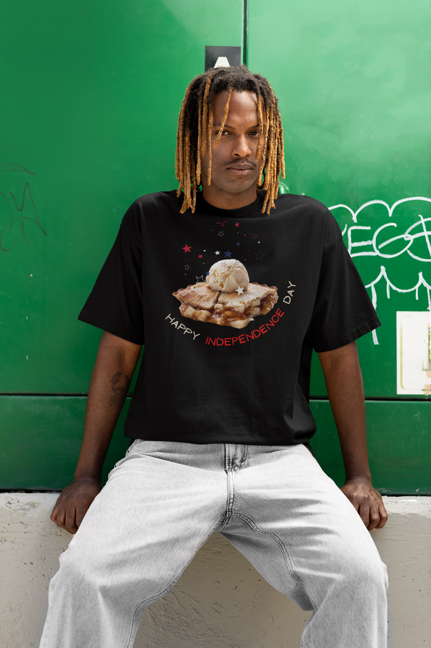 A man wearing Unisex Oversized "A Piece of Apple Pie" Black T-shirt at front view - Unique Fashion Tops, Design for 4th of July, Front and Back Print - Oh Mine Words.