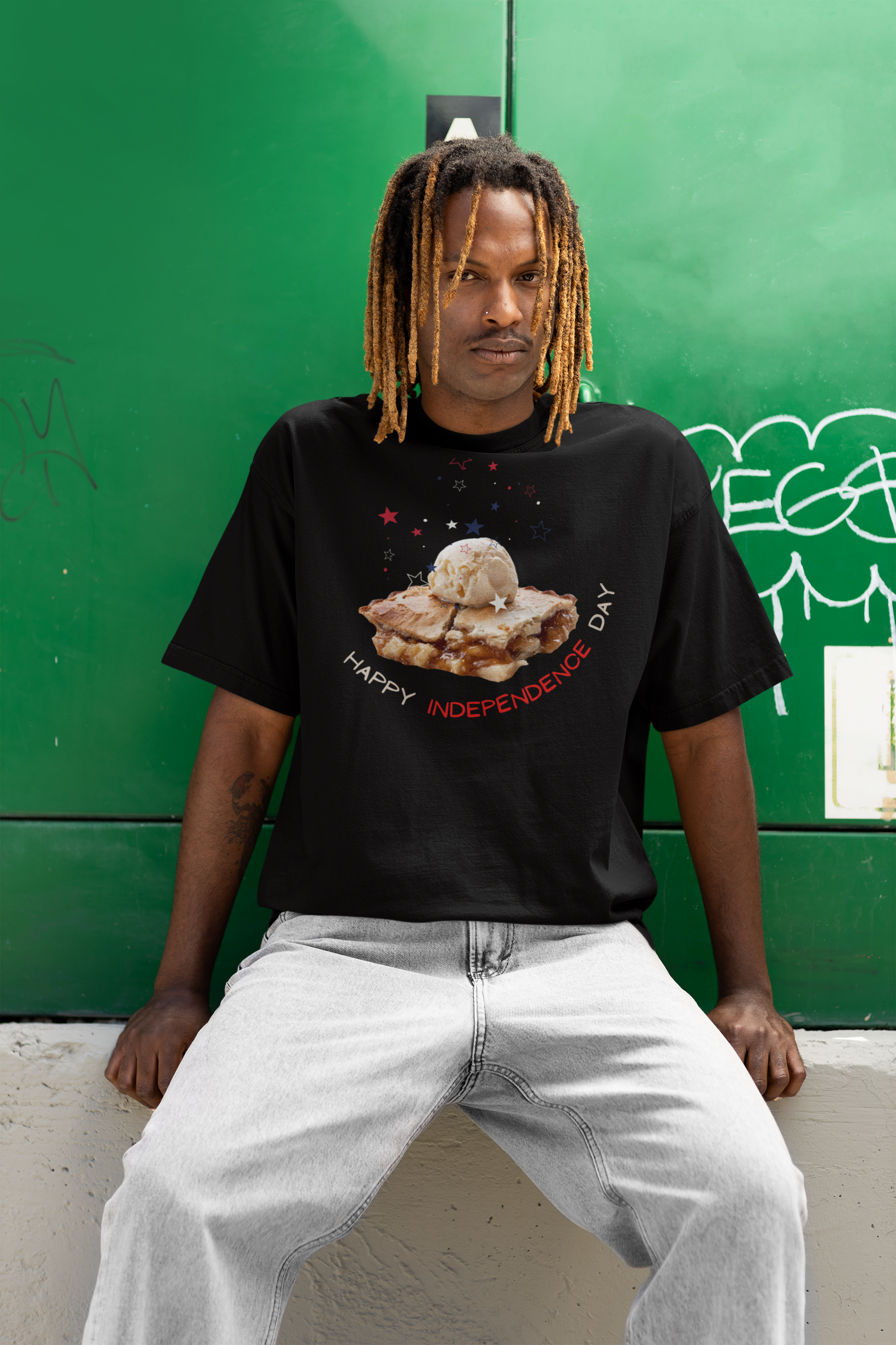 A man wearing Unisex Oversized "A Piece of Apple Pie" Black T-shirt at front view - Unique Fashion Tops, Design for 4th of July, Front and Back Print - Oh Mine Words.