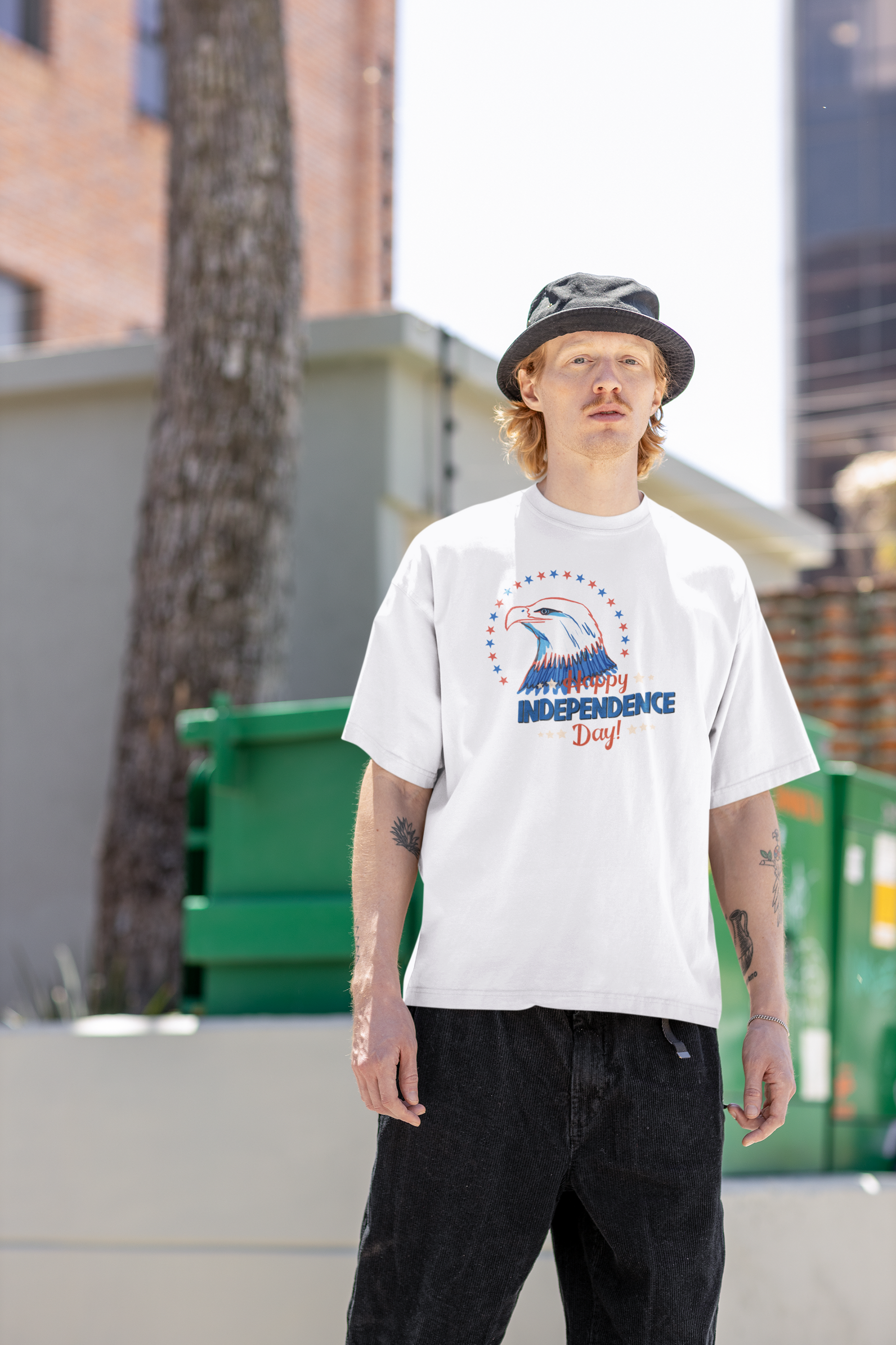 A man wearing Unisex Oversized "The Eagle (Independence Day)" White T-shirt at front view - Unique Fashion Tops, Front and Back Print - Oh Mine Words.