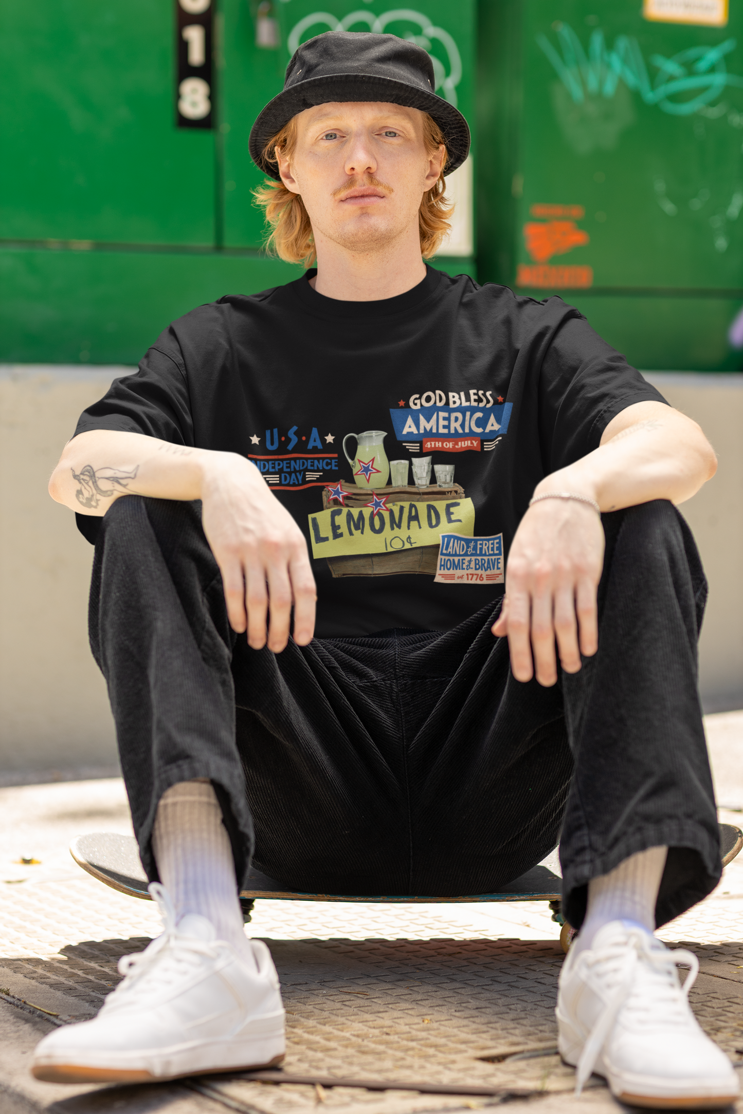A man wearing Unisex Oversized The Lemonade T-shirt for 4th of July at front view – Unique Fashion Tops – Cool, Comfortable, Standout Black Streetwear with Front and Back Print – Oh Mine Words