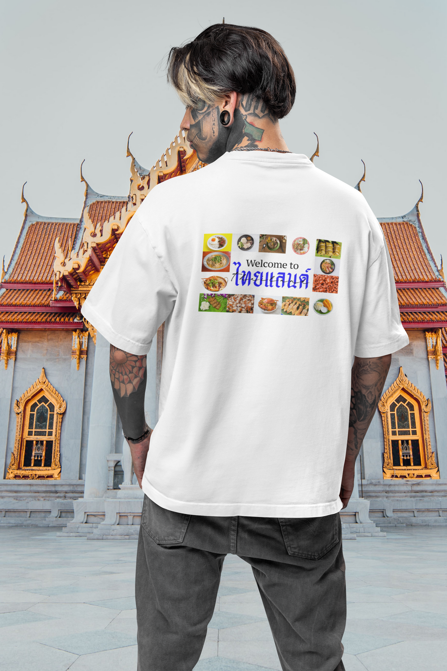 A man wearing "Welcome to ไทยแลนด์ (Thailand)" Comfortable Unisex Oversized White T-shirt at back view - Unique Fashion Tops - Foodie, Thai Style, Bangkok - Front and Back printed tee - Oh Mine Words