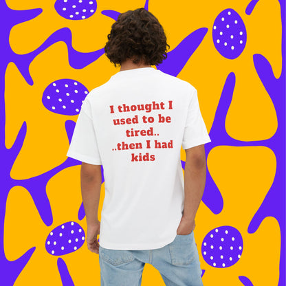 A man wearing unisex oversized "I Thought I Used To Be Tired (White)" t-shirt at back view - unique fashion tops, funny quote for Adulthood, Parents, Parenthood, Dad, Mom - Front and Back Print - Oh Mine Words.