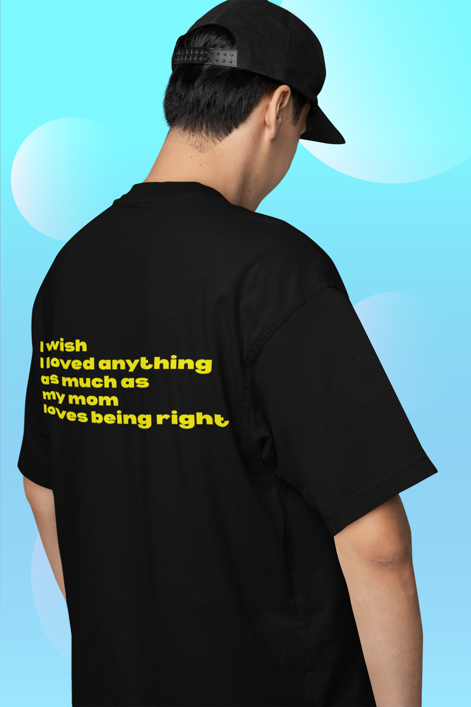 A man wearing unisex oversized "I wish I loved anything as much as my mom loves being right" black t-shirt at back view - unique fashion tops, funny quote for Mother's Day - Front and Back Print - Oh Mine Words.
