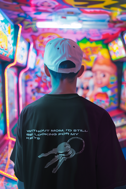 A man wearing unisex oversized "Without mom, I'd still be looking for my keys" black t-shirt at back view - Unique Fashion Tops, Heartfelt and funny quote tee for adulthood and Mother's day - front and back print - Oh Mine Words.