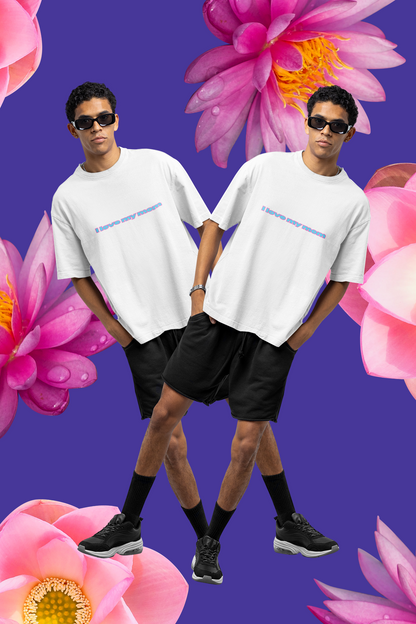 A man wearing white unisex oversized "I Love My Mom Oversized T-Shirt (Basic)" at front view, Mother's day - unique fashion tops, front and back print - Oh Mine Words.