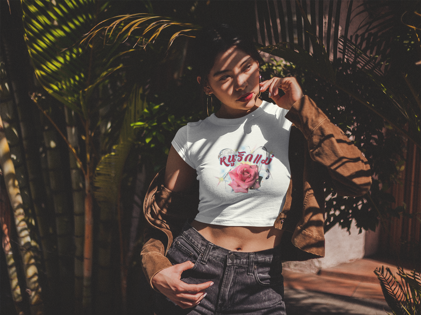 A women wearing "หนูรักแม่ เบบี้ที (ดอกกุหลาบ) - I Love Mom Baby Tee (Rose)" white baby tee/ crop top/ slim fit tee at close-up front view - Unique fashion tops perfect for casual wear and Mother's day - Thai twist Y2k style - Front and Back printed t-shirt - Oh Mine Words