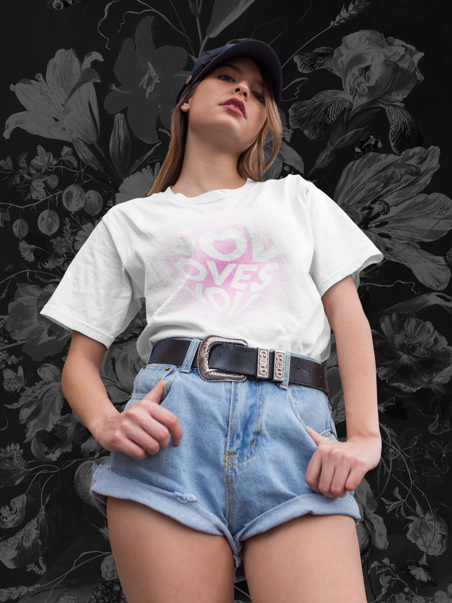 A women wearing "God Loves You" unisex oversized white t-shirt at front view. Unique fashion tops - cute Y2k, good vibe tee. Front and back printed - Oh Mine Words
