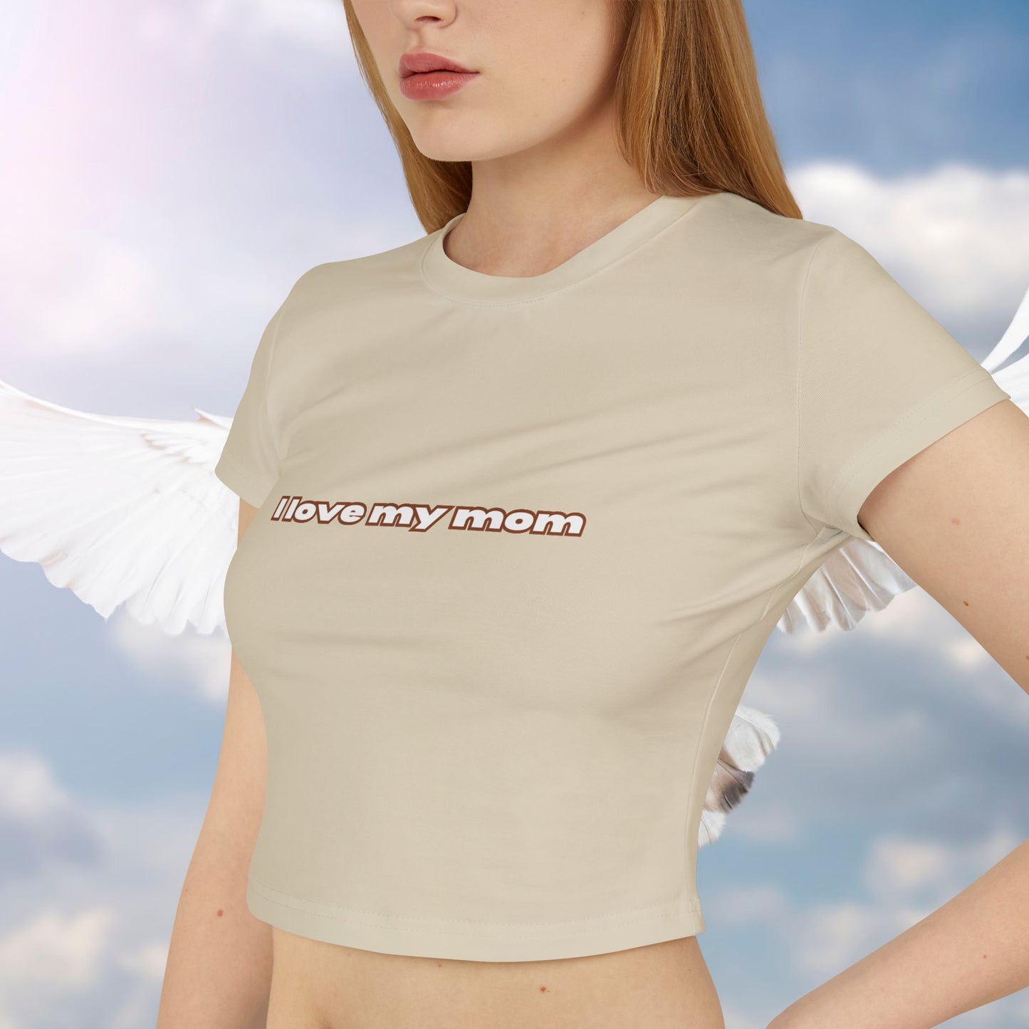 A women wearing (Sand-tone color) "I Love My Mom Baby Tee (Basic)"/ crop top/ slim fit tee at close-up front view - Unique fashion tops for casual wear and Mother's day - Minimal Y2k style - Front and Back printed T-shirt - Oh Mine Words