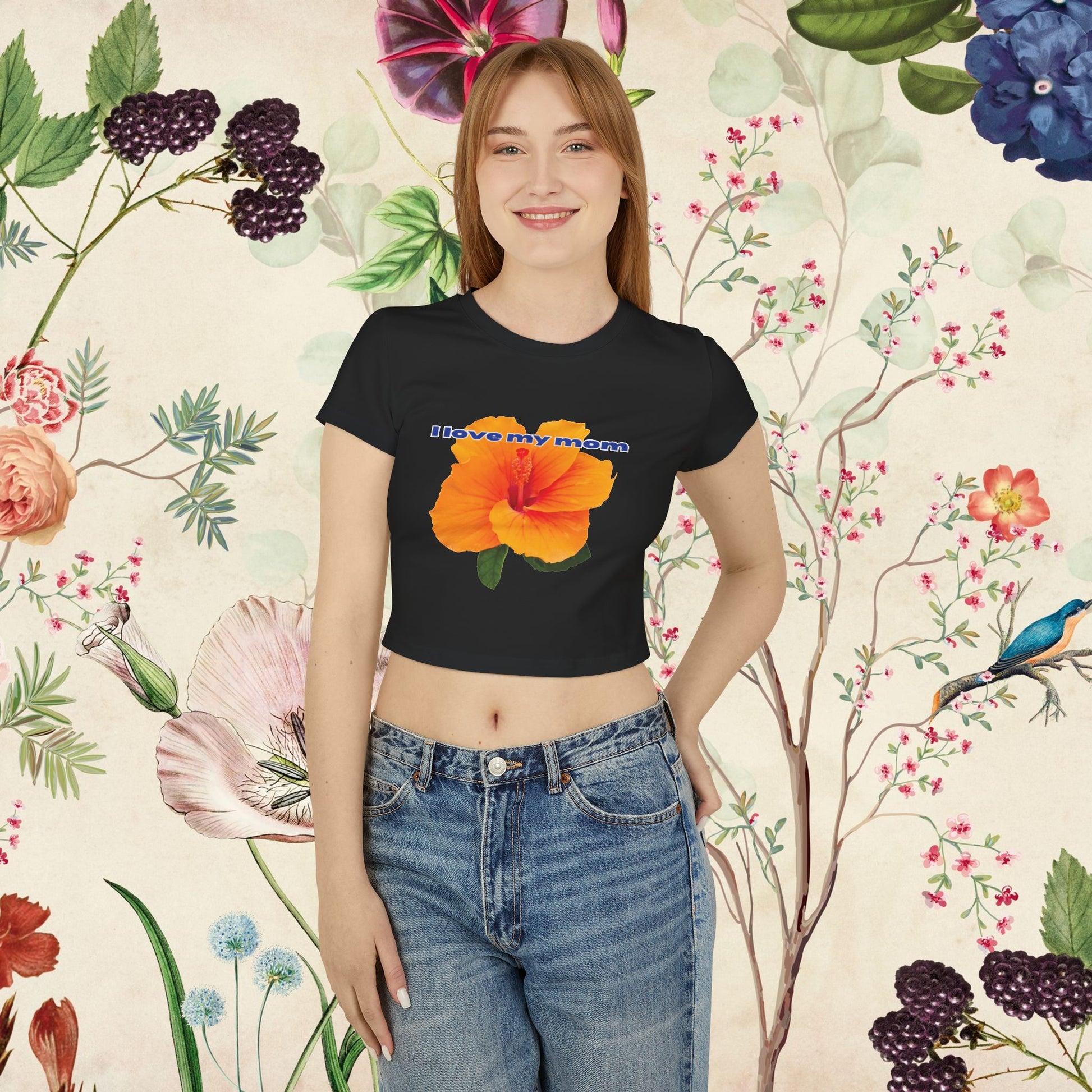 A women wearing black "I Love My Mom Baby Tee (Hibiscus)"/ crop top/ slim fit tee  at front view - Unique fashion tops for casual wear and Mother's day - Flower Y2k style - Front and Back printed T-shirt - Oh Mine Words