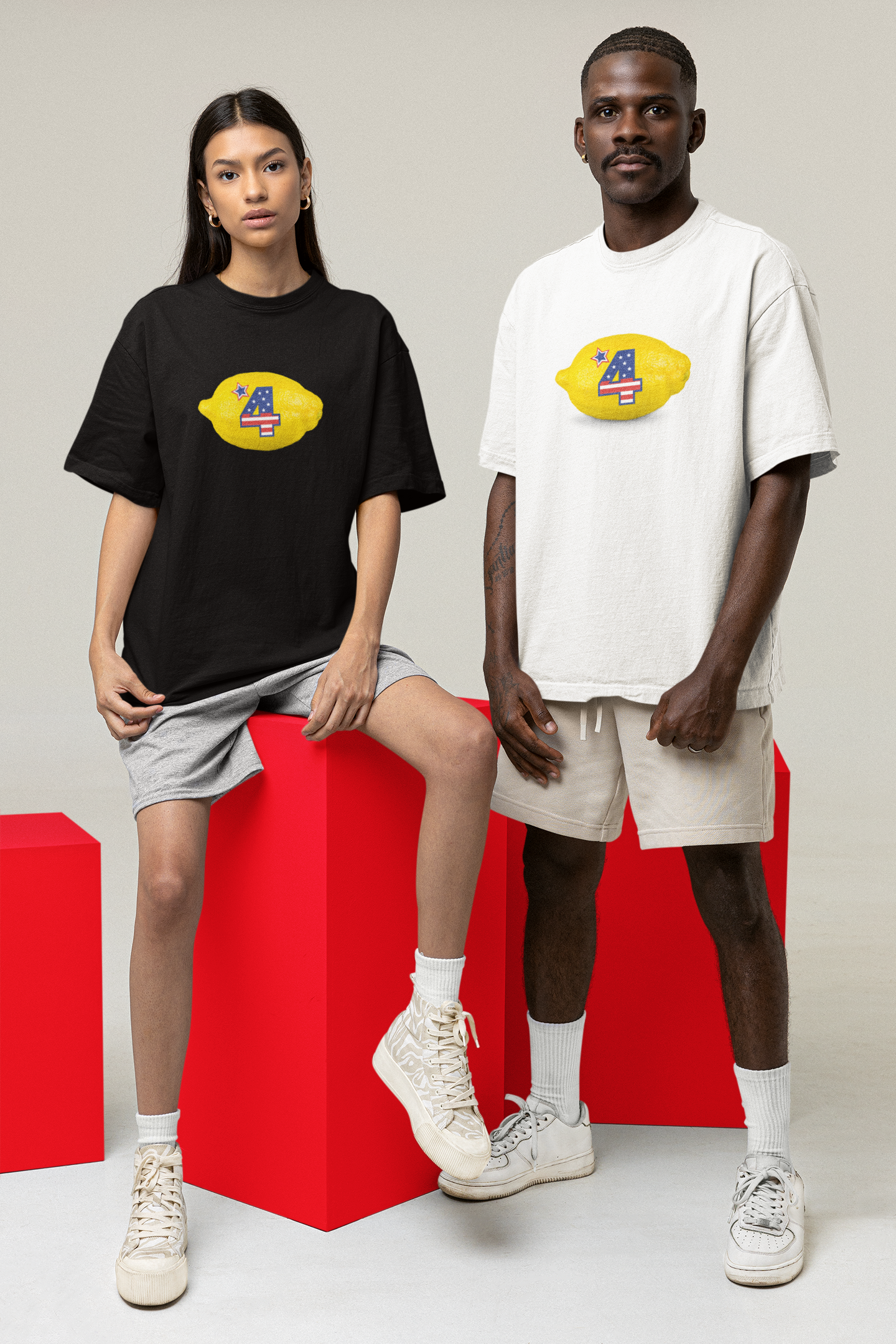 A women wearing black "The Fourth" T-shirt, A man wearing white "The Fourth" T-shirt for American's 4th of July at front view - Unisex oversized, comfortable, streetwear, chic, cool, unique fashion tops - Front and Back print - Oh Mine Words