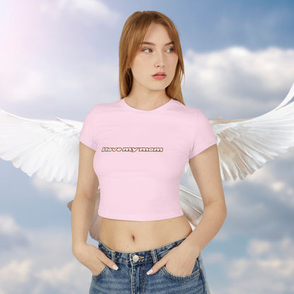 A women wearing light pink "I Love My Mom Baby Tee (Basic)"/ crop top/ slim fit tee at front view - Unique fashion tops for casual wear and Mother's day - Minimal Y2k style - Front and Back printed T-shirt - Oh Mine Words