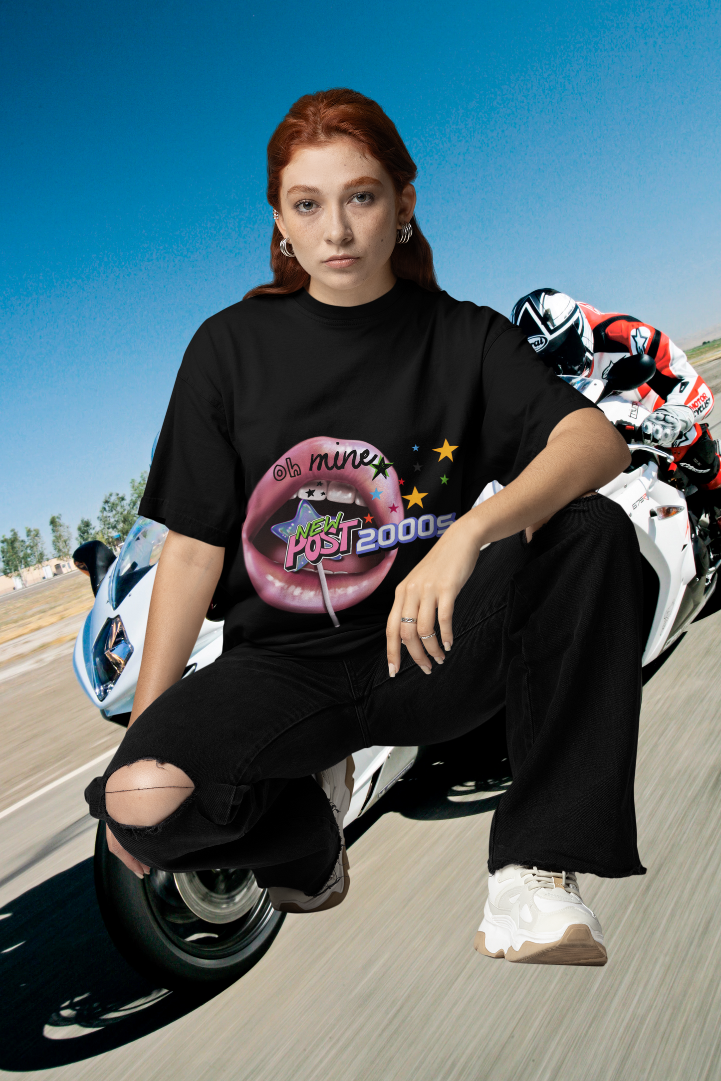 A women wearing unisex oversized "2000s Lip" black t-shirt at front view - Unique Fashion Tops, Y2K, 90s, Old-School style - Front and Back Print - Oh Mine Words.