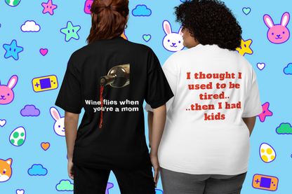Left women wearing "Wine flies when you're a mom (Black)", Right women wearing "I Thought I Used To Be Tired (White)", unisex oversized t-shirt at back view - unique fashion tops, funny quote for Adulthood, Parents, Parenthood, Dad, Mom - Front and Back Print - Oh Mine Words.